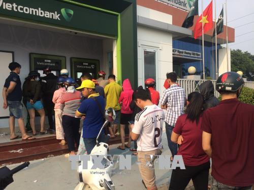 Ngân hàng Nhà nước chưa cho phép các ngân hàng tăng phí rút tiền nội mạng