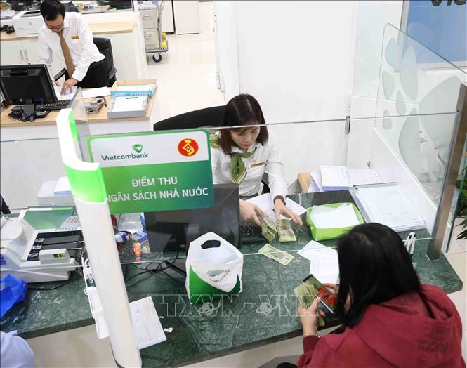 Nhiều ngân hàng giảm phí dịch vụ về 0 đồng từ hôm nay 14-2