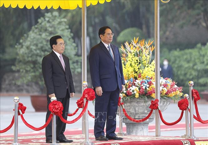 Thủ tướng Phạm Minh Chính chủ trì Lễ đón Thủ tướng Lào Phankham Viphavanh thăm chính thức Việt Nam